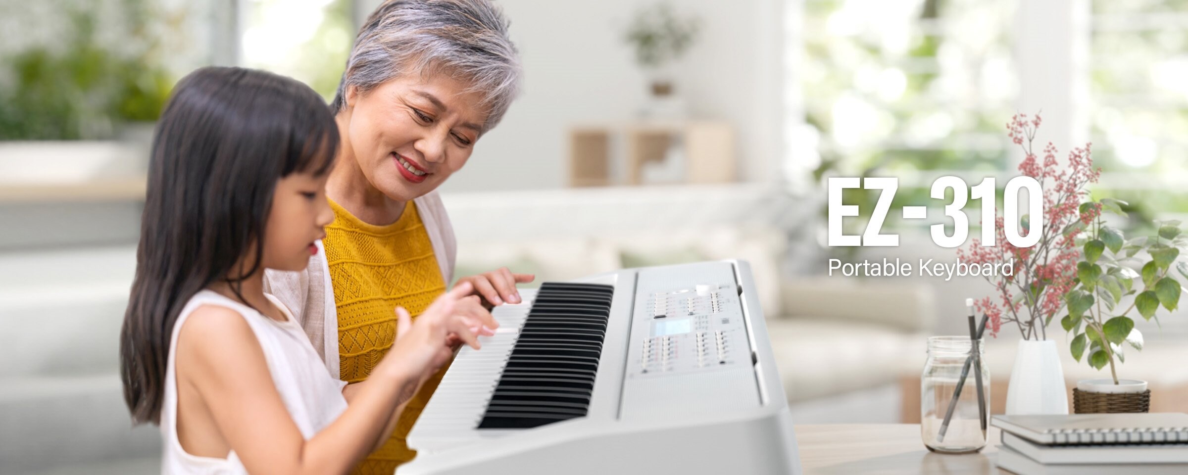 Children and women are smiling and playing the EW-310.